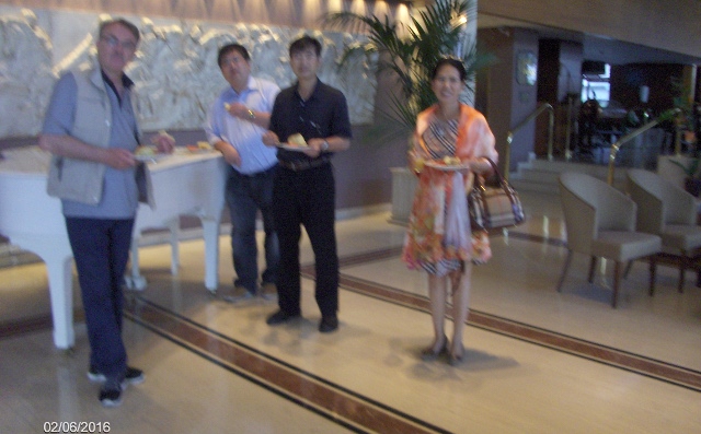 Last custemers having the breakfast in the hotel lobby.